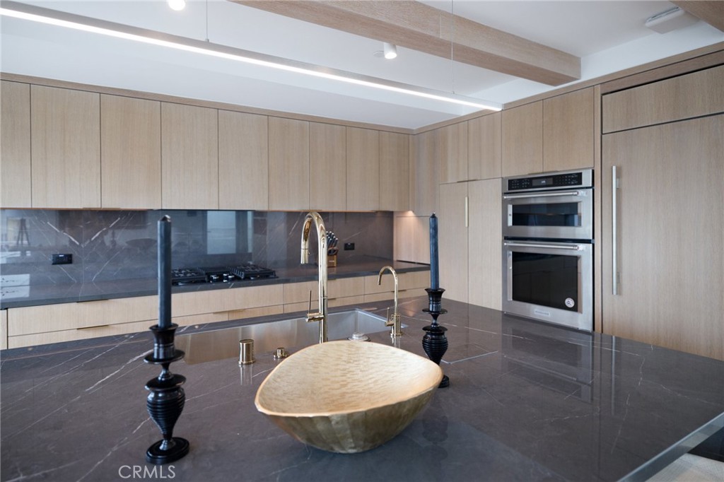 4310 Ocean Drive Manhattan Beach, CA 90266 - Photo 11 of 54 a kitchen with a sink cabinets and appliances