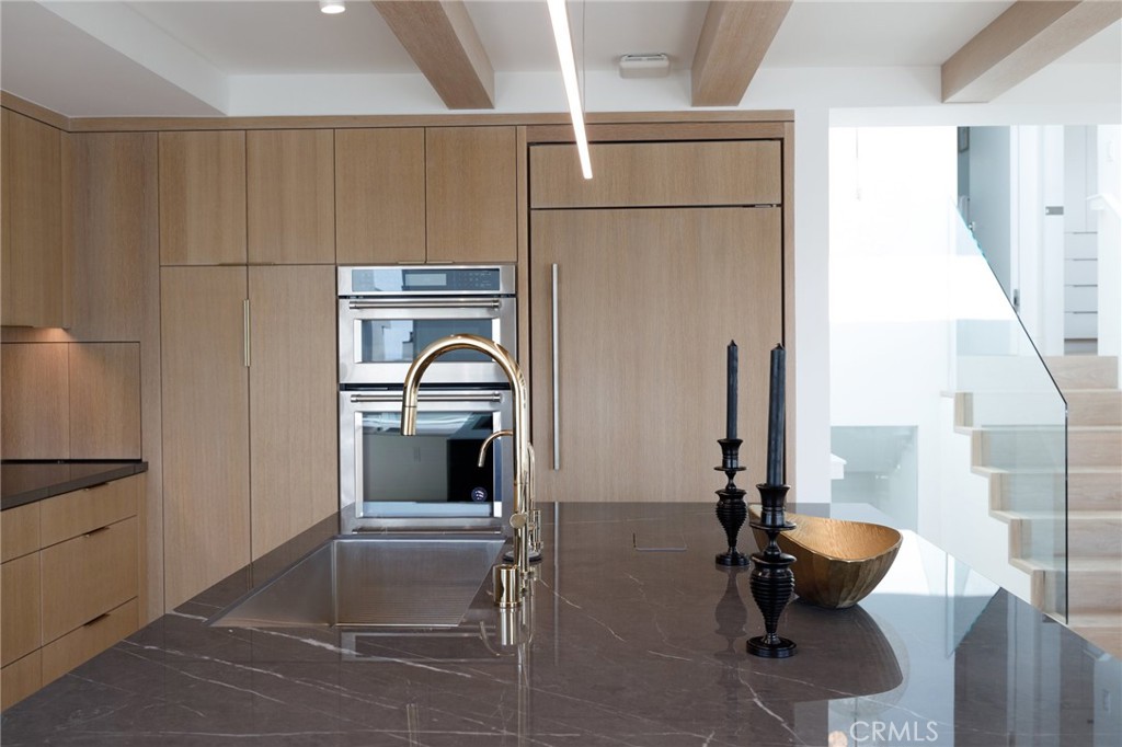 4310 Ocean Drive Manhattan Beach, CA 90266 - Photo 12 of 54 a bathroom with a sink and a washing machine