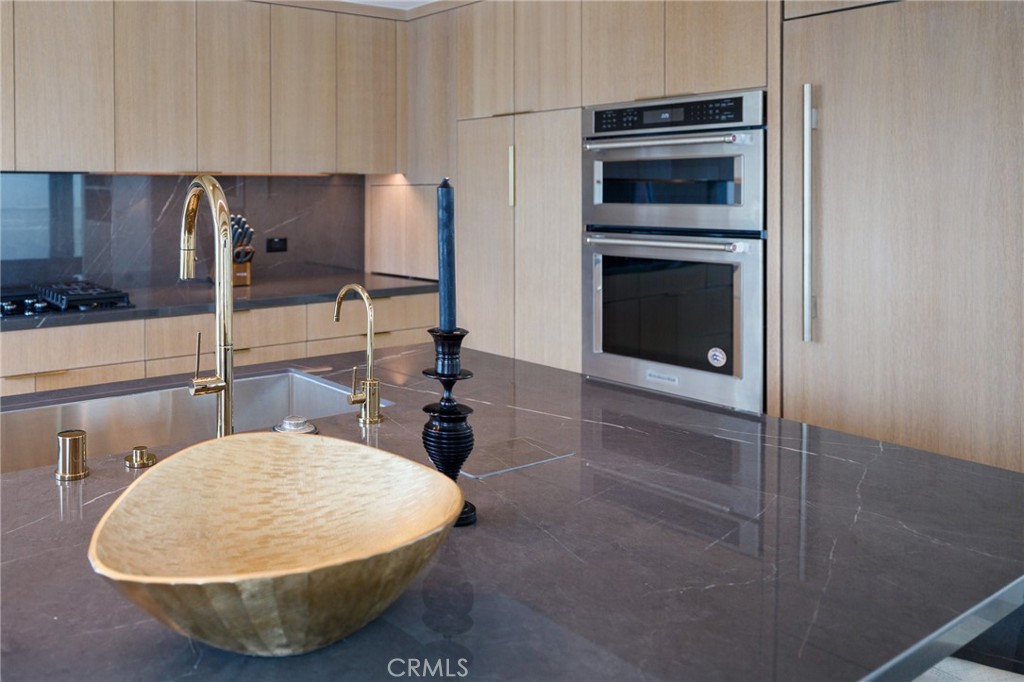 4310 Ocean Drive Manhattan Beach, CA 90266 - Photo 16 of 54 a room with a sink and cabinets