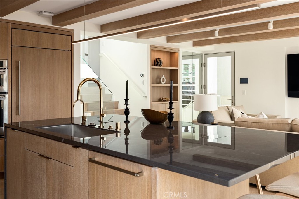 4310 Ocean Drive Manhattan Beach, CA 90266 - Photo 17 of 54 a kitchen with a counter top a sink and cabinets