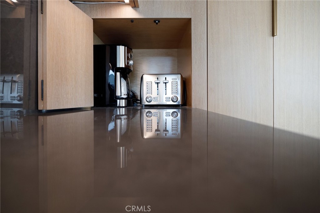 4310 Ocean Drive Manhattan Beach, CA 90266 - Photo 19 of 54 a view of a hallway with wooden floor and a cabinet