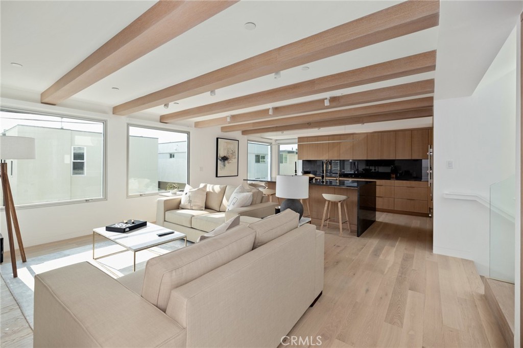 4310 Ocean Drive Manhattan Beach, CA 90266 - Photo 2 of 54 a living room with furniture a flat screen tv and kitchen view
