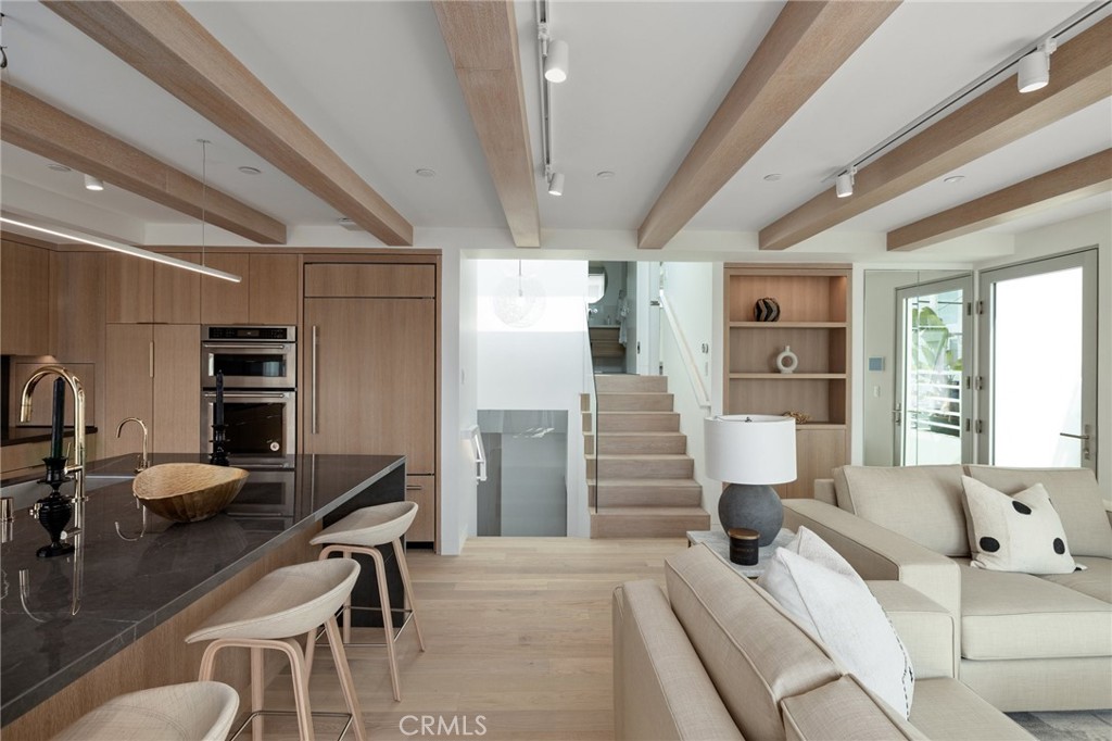4310 Ocean Drive Manhattan Beach, CA 90266 - Photo 24 of 54 a living room with furniture and a flat screen tv