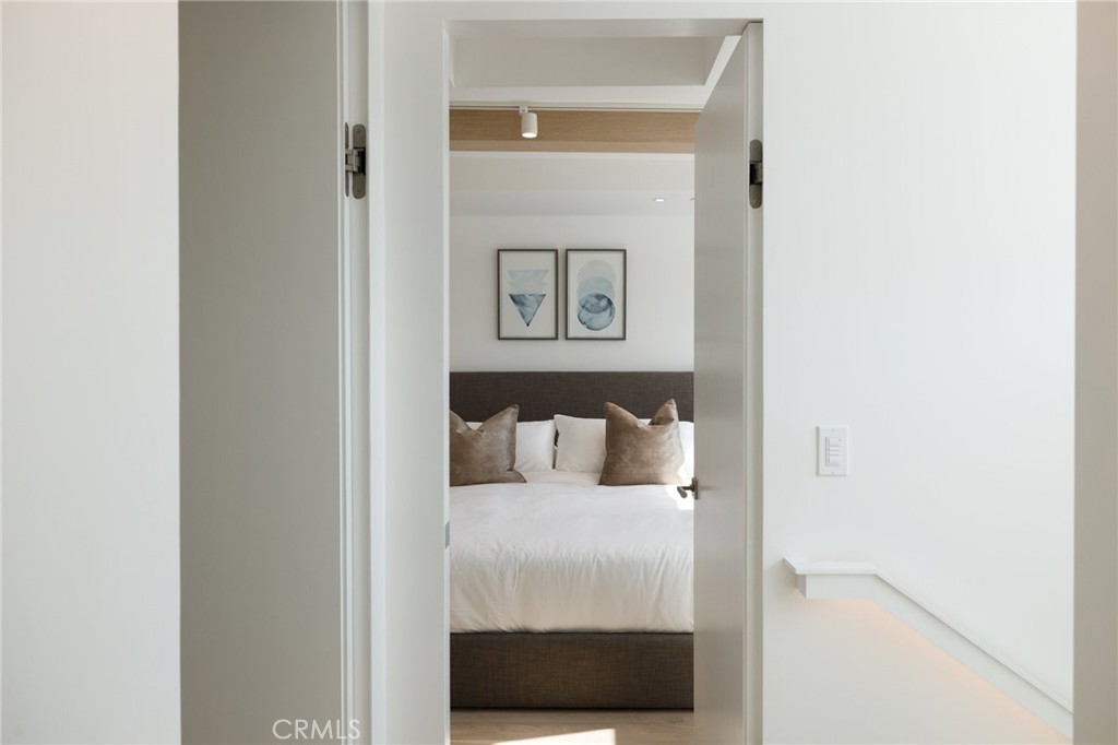4310 Ocean Drive Manhattan Beach, CA 90266 - Photo 29 of 54 a bed room with a bed and a night stand