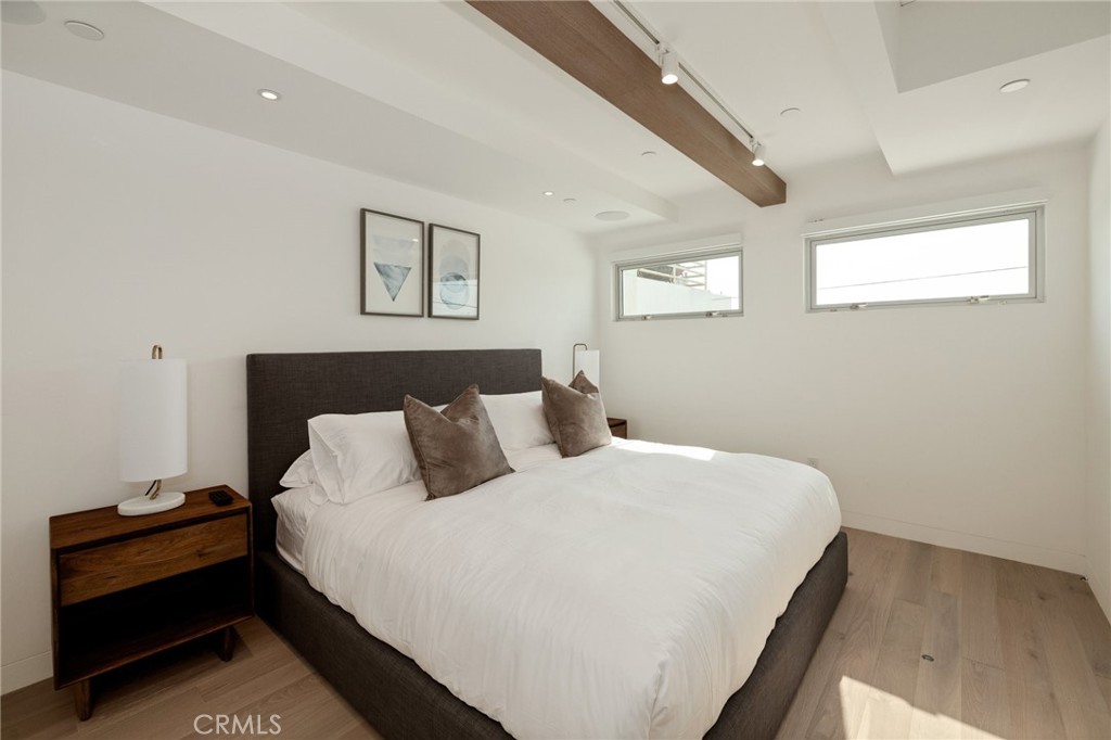 4310 Ocean Drive Manhattan Beach, CA 90266 - Photo 30 of 54 a bedroom with bed and a window