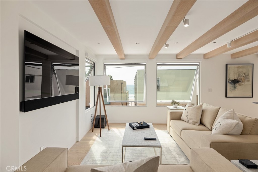 4310 Ocean Drive Manhattan Beach, CA 90266 - Photo 3 of 54 a living room with furniture and a flat screen tv