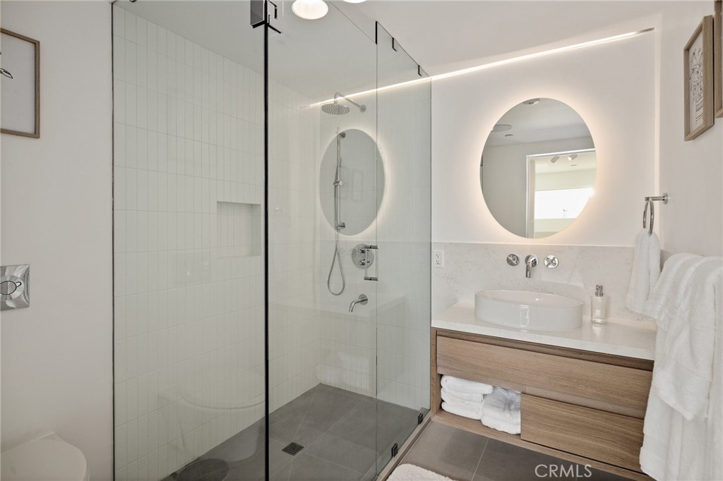 4310 Ocean Drive Manhattan Beach, CA 90266 - Photo 32 of 54 a bathroom with a sink mirror and toilet