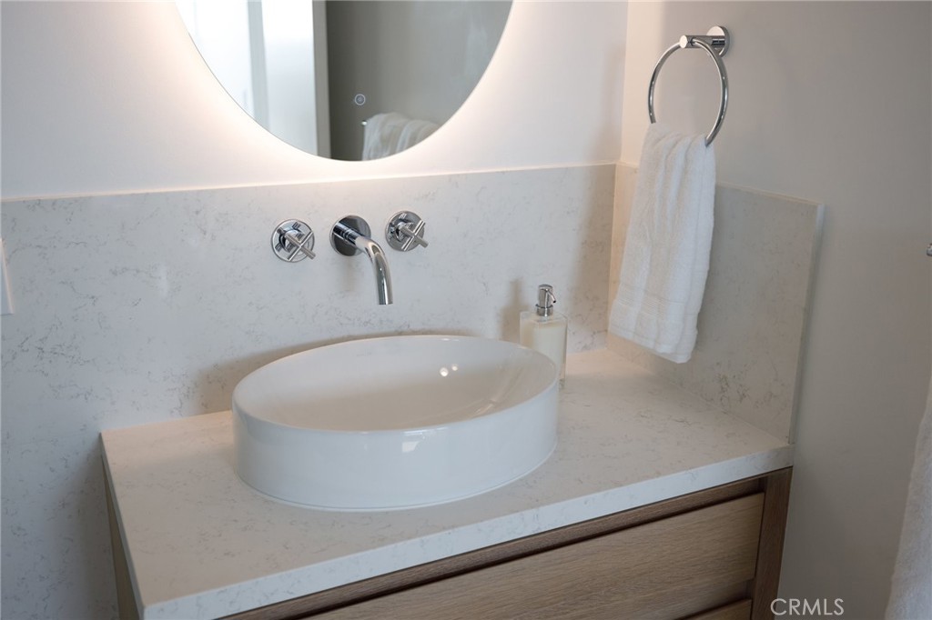 4310 Ocean Drive Manhattan Beach, CA 90266 - Photo 33 of 54 a bath tub sitting next to a white sink and vanity