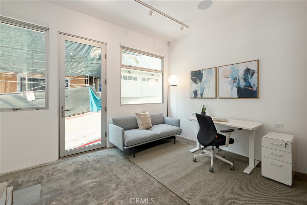 4310 Ocean Drive Manhattan Beach, CA 90266 - Photo 41 of 54 a living room with furniture and a window