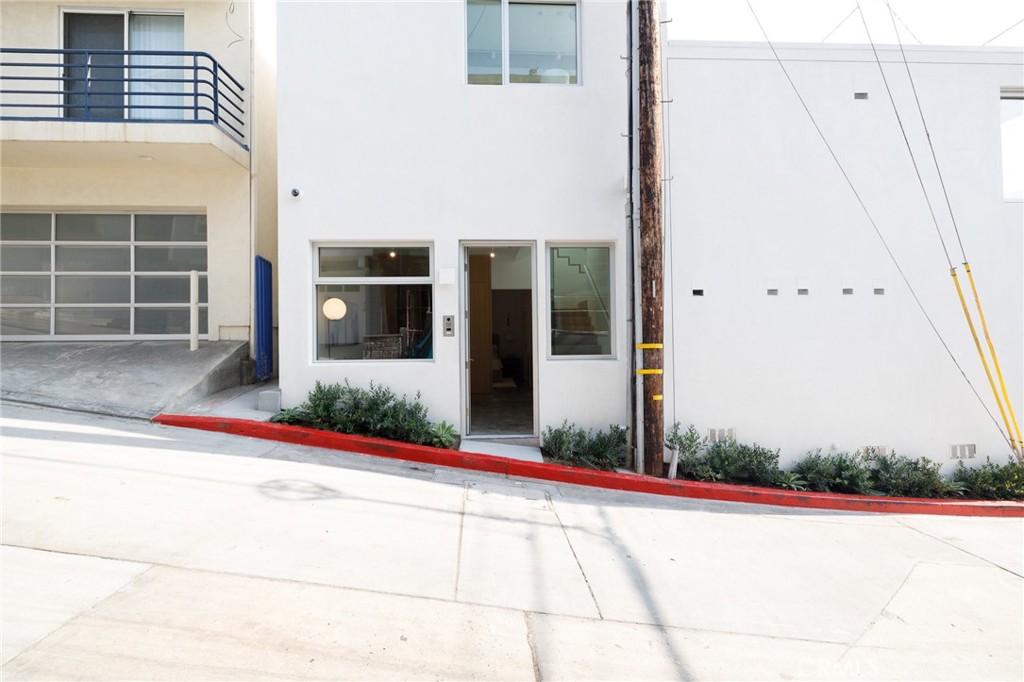 4310 Ocean Drive Manhattan Beach, CA 90266 - Photo 42 of 54 a view of a brick house with a small yard
