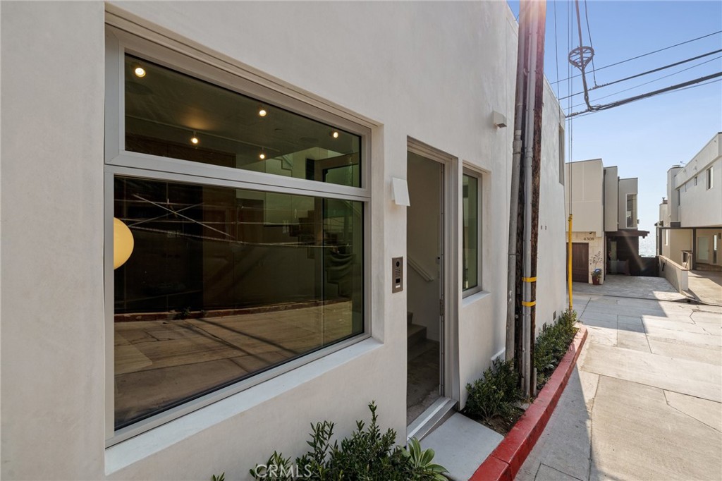 4310 Ocean Drive Manhattan Beach, CA 90266 - Photo 43 of 54 a living room with a large window and furniture