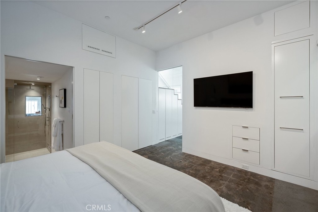 4310 Ocean Drive Manhattan Beach, CA 90266 - Photo 49 of 54 a bedroom with a bed and a flat screen tv