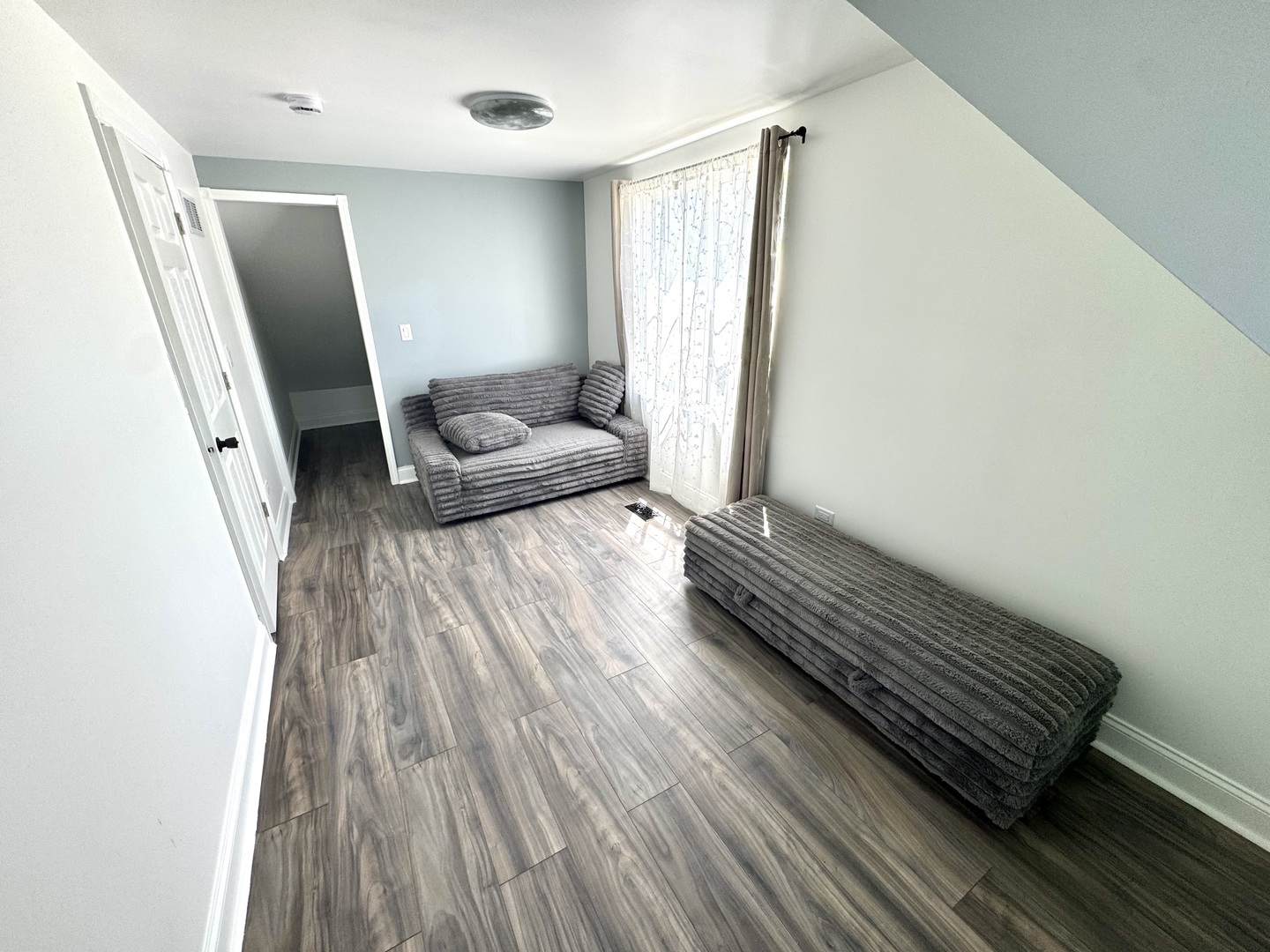 931 South Rawson Bridge Road Cary, IL 60013 - Photo 18 of 36 a living room with furniture and a rug