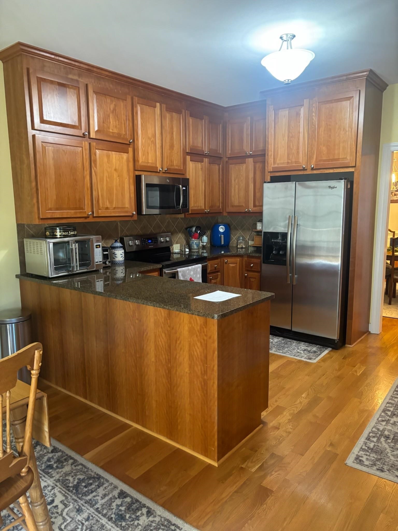 208 Morgan Court Waynesboro, VA 22980 - Photo 6 of 7 a kitchen with granite countertop a refrigerator stove top oven a sink and dishwasher