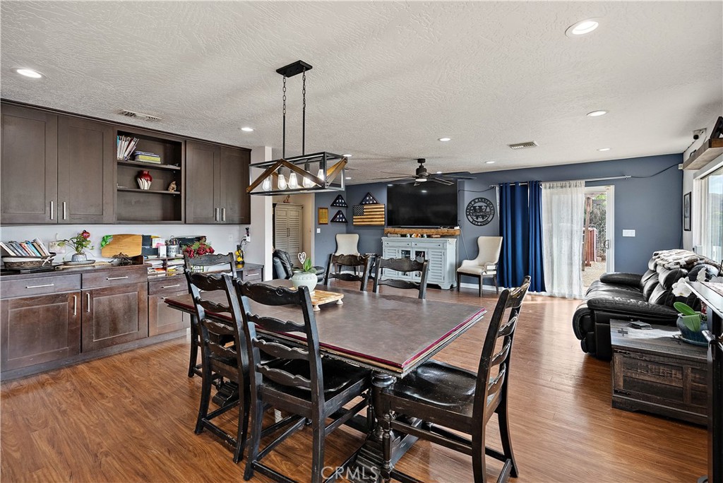 24444 Scotch Lane Colton, CA 92324 - Photo 13 of 43 a view of a dining room and livingroom with furniture wooden floor a chandelier