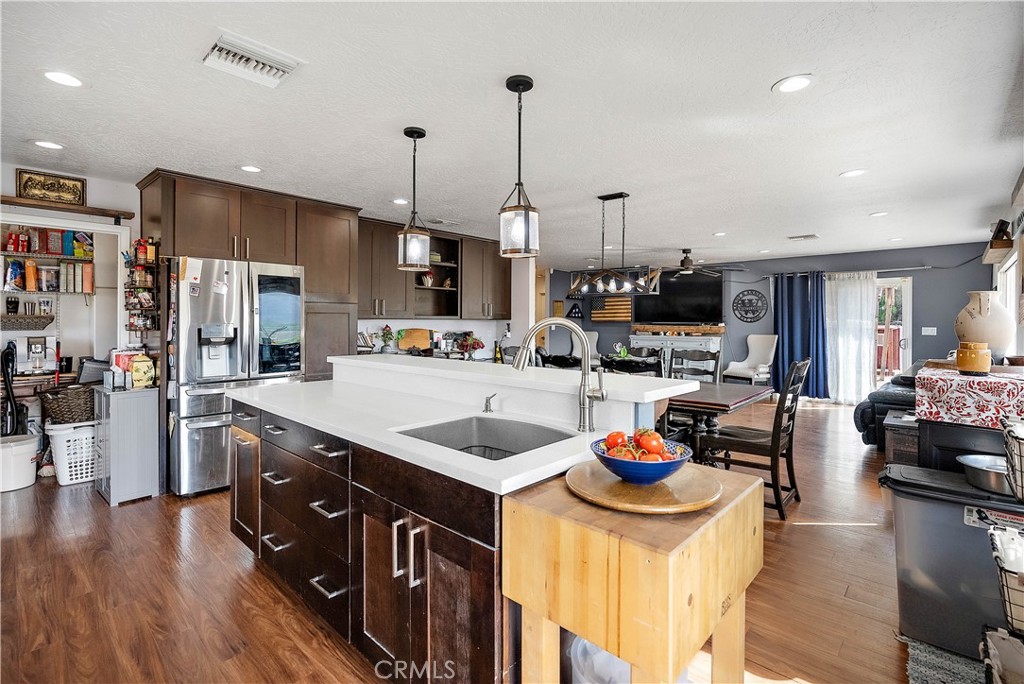 24444 Scotch Lane Colton, CA 92324 - Photo 17 of 43 a kitchen with stainless steel appliances granite countertop a sink stove and refrigerator