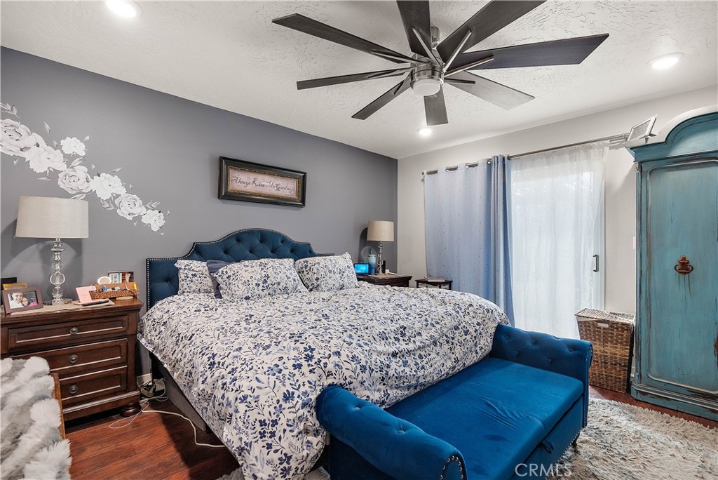 24444 Scotch Lane Colton, CA 92324 - Photo 19 of 43 a bedroom with bed and a chandelier