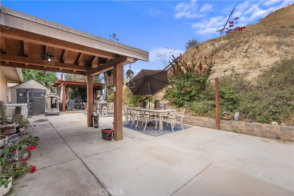 24444 Scotch Lane Colton, CA 92324 - Photo 2 of 43 a view of a patio with table and chairs potted plants