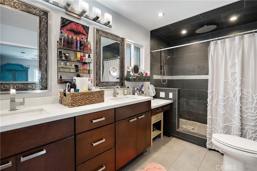 24444 Scotch Lane Colton, CA 92324 - Photo 21 of 43 a bathroom with a sink vanity granite and toilet