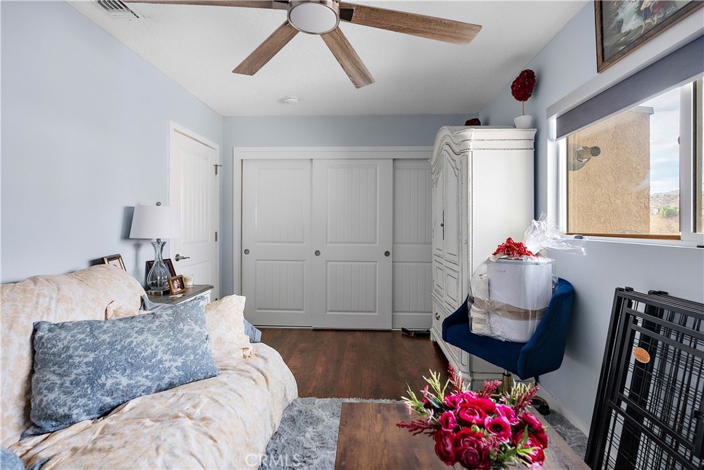 24444 Scotch Lane Colton, CA 92324 - Photo 26 of 43 a bedroom with furniture and a large window