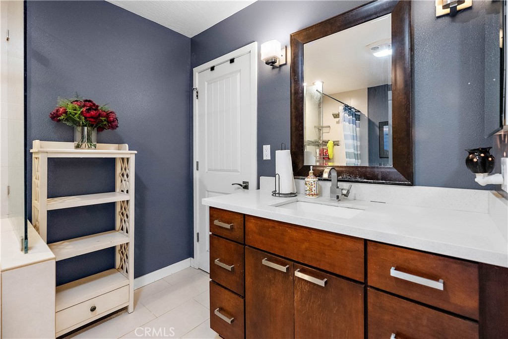 24444 Scotch Lane Colton, CA 92324 - Photo 27 of 43 a bathroom with a sink vanity and a mirror