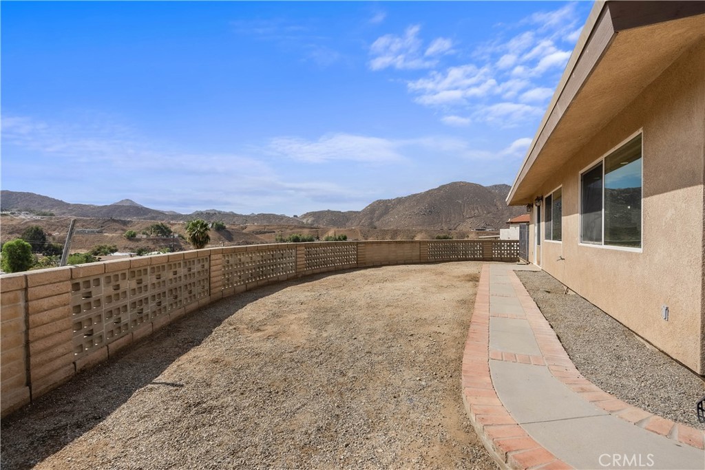 24444 Scotch Lane Colton, CA 92324 - Photo 38 of 43 a view of balcony with wooden floor and mountains in the background
