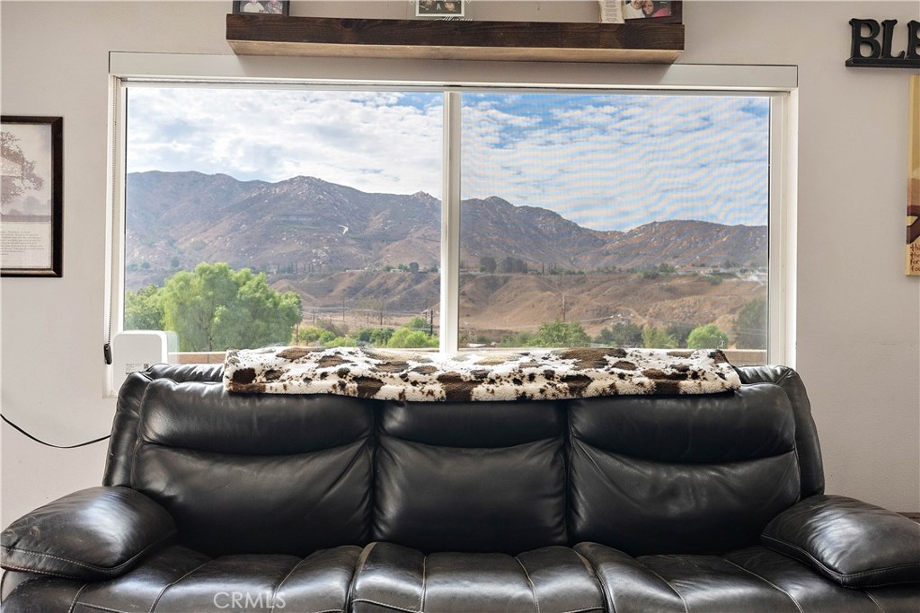 24444 Scotch Lane Colton, CA 92324 - Photo 8 of 43 a living room with furniture and a large window