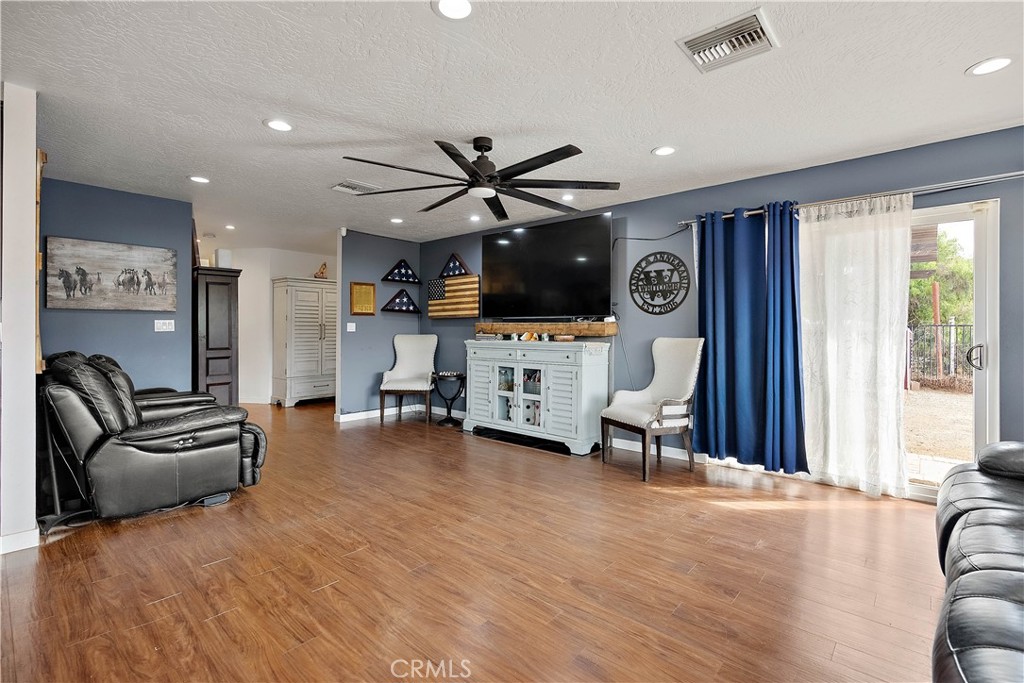 24444 Scotch Lane Colton, CA 92324 - Photo 9 of 43 a living room with furniture and a flat screen tv