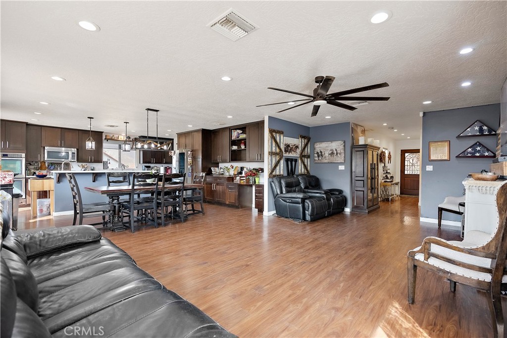 24444 Scotch Lane Colton, CA 92324 - Photo 10 of 43 a living room filled with furniture and kitchen view