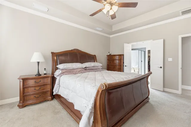a bedroom with bed and window