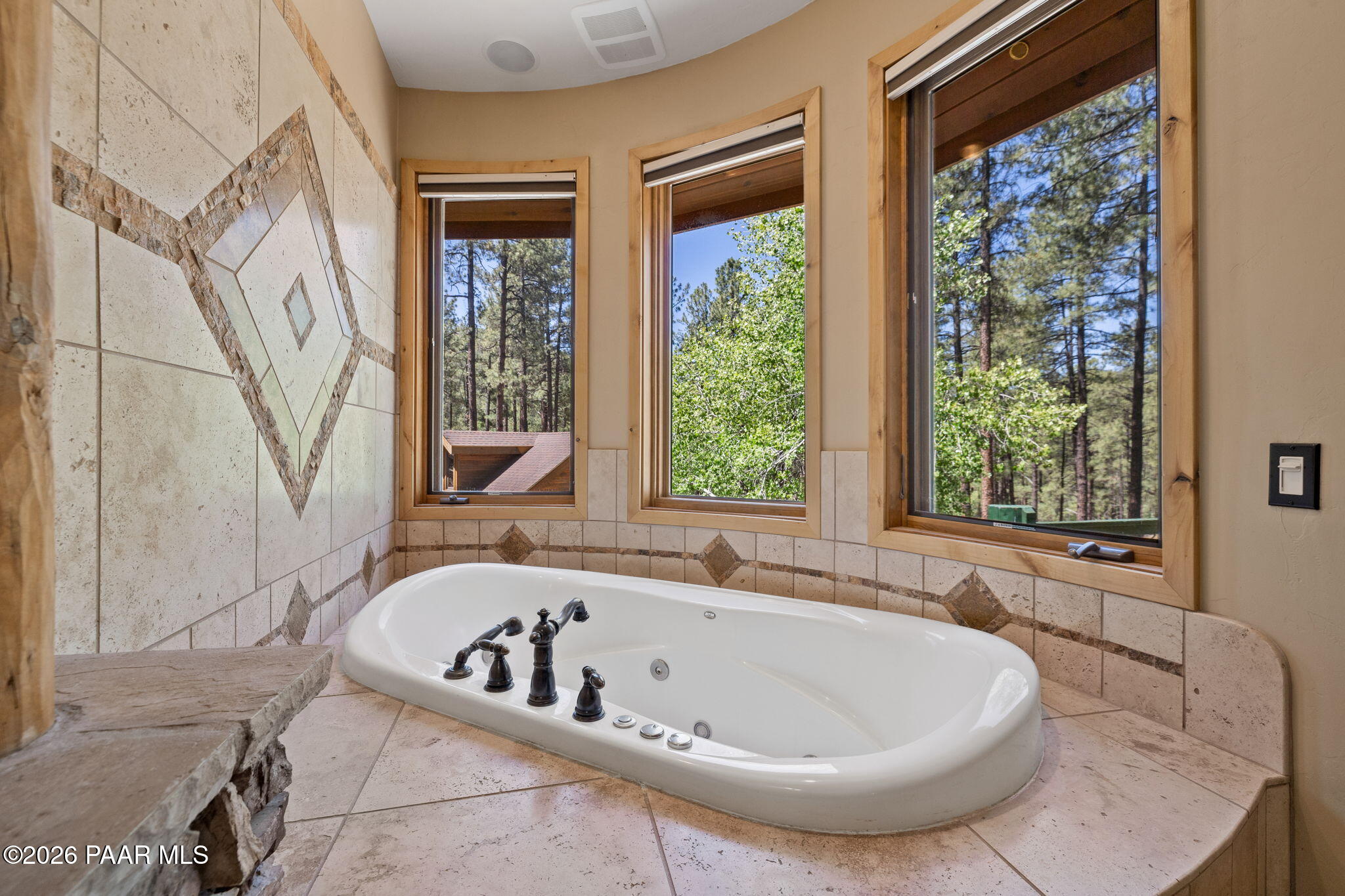 5140 East Charcoal Kiln Road Prescott, AZ 86303 - Photo 51 of 140 a bath tub sitting in a bathroom next to a window