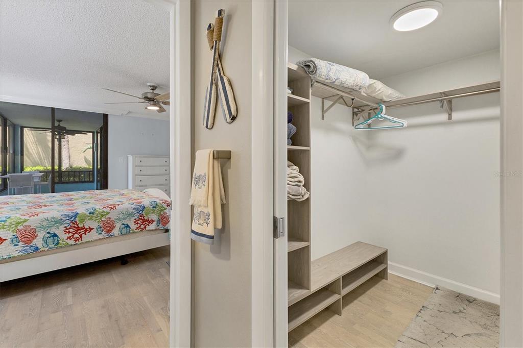 8776 Midnight Pass Road, Unit C107 Sarasota, FL 34242 - Photo 18 of 47 a bedroom with a bed and a window