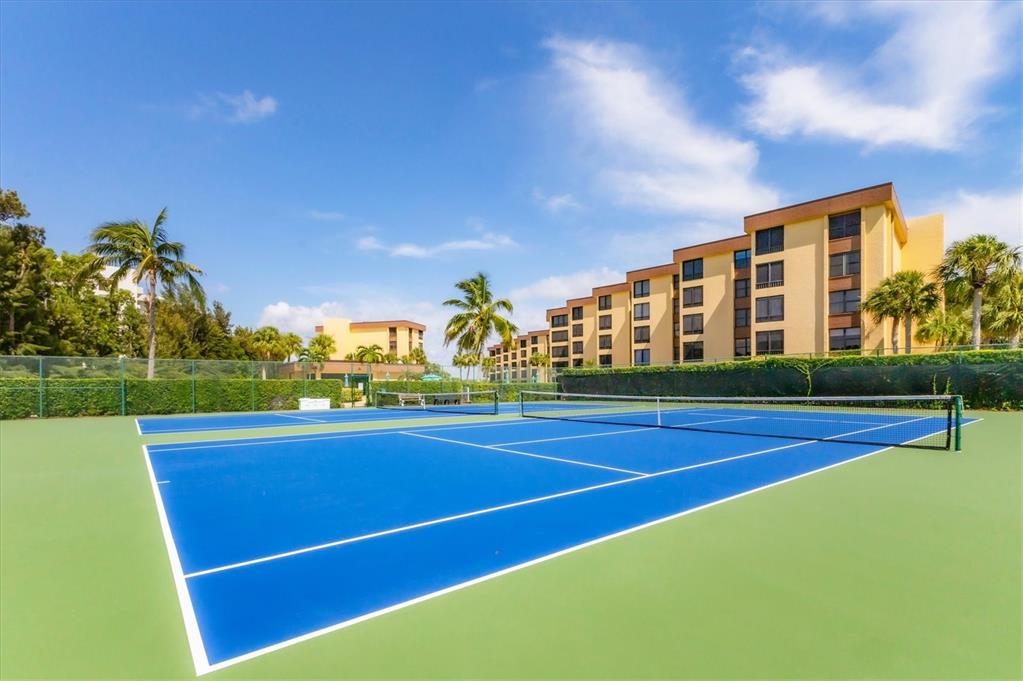 8776 Midnight Pass Road, Unit C107 Sarasota, FL 34242 - Photo 42 of 47 a view of an outdoor space and basketball court