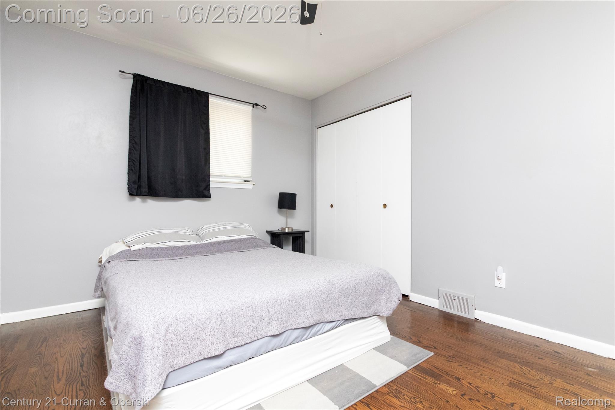 3220 Alice Street Dearborn, MI 48124 - Photo 21 of 39 Bedroom with wood-finish flooring, light gray walls, and white baseboards