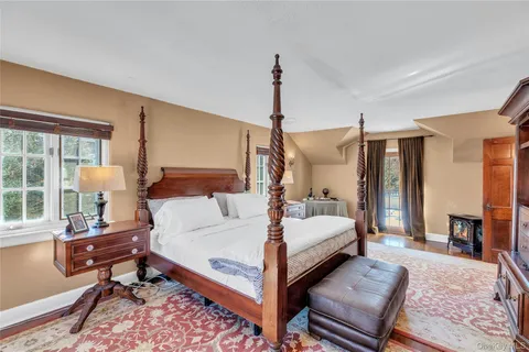 a bed room with a bed and wooden floor