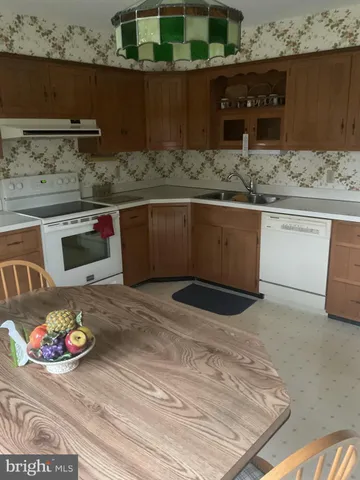 a kitchen with a stove and a sink