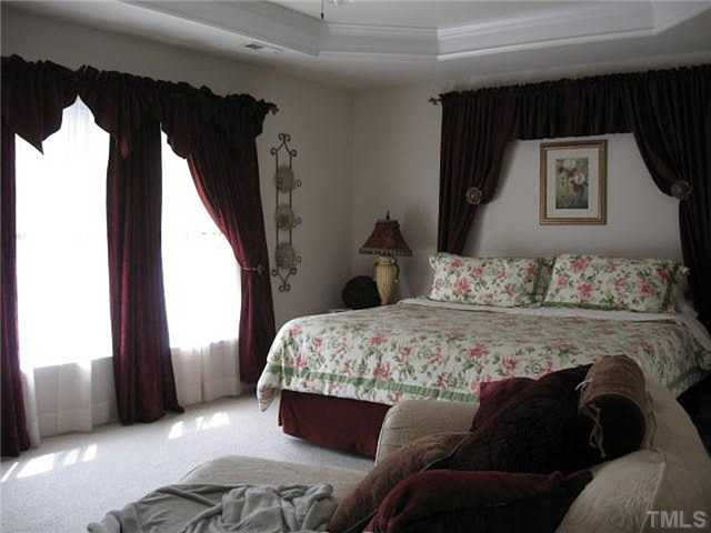 204 Bradson Road Morrisville, NC 27560 - Photo 11 of 24 Master bed room with trey ceiling