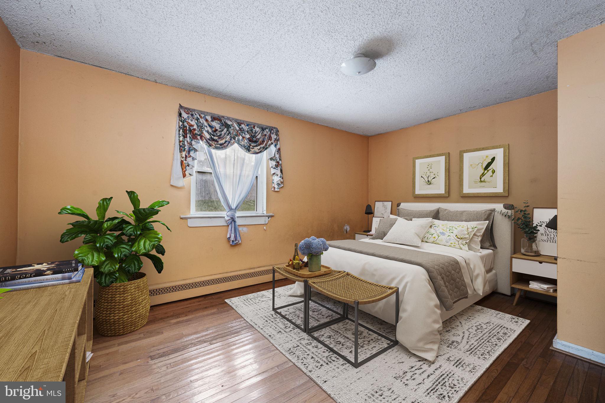 1016 West Boot Road Downingtown, PA 19335 - Photo 13 of 30 a bed room with a bed and a potted plant