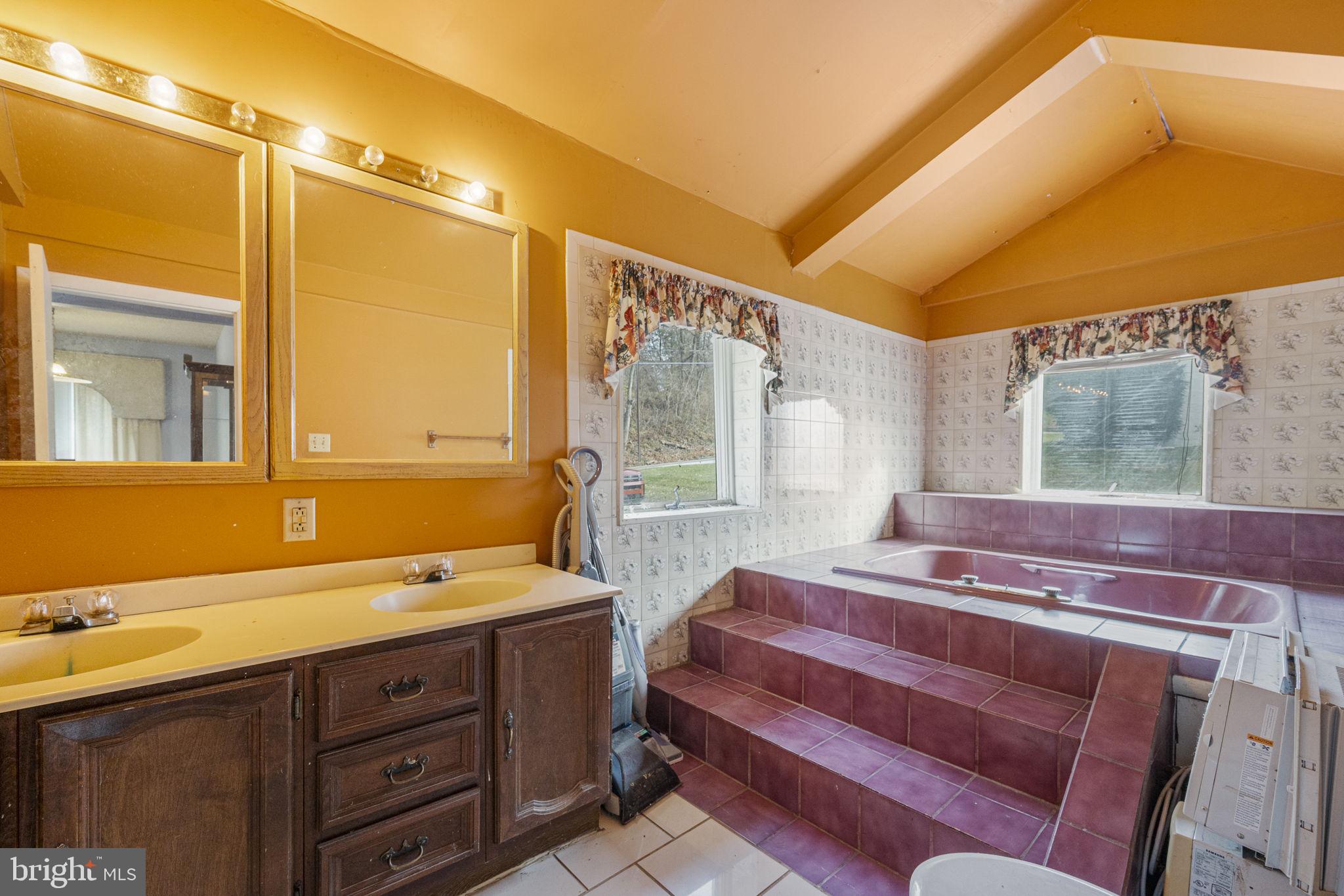 1016 West Boot Road Downingtown, PA 19335 - Photo 16 of 30 a spacious bathroom with a double vanity sink and a large mirror