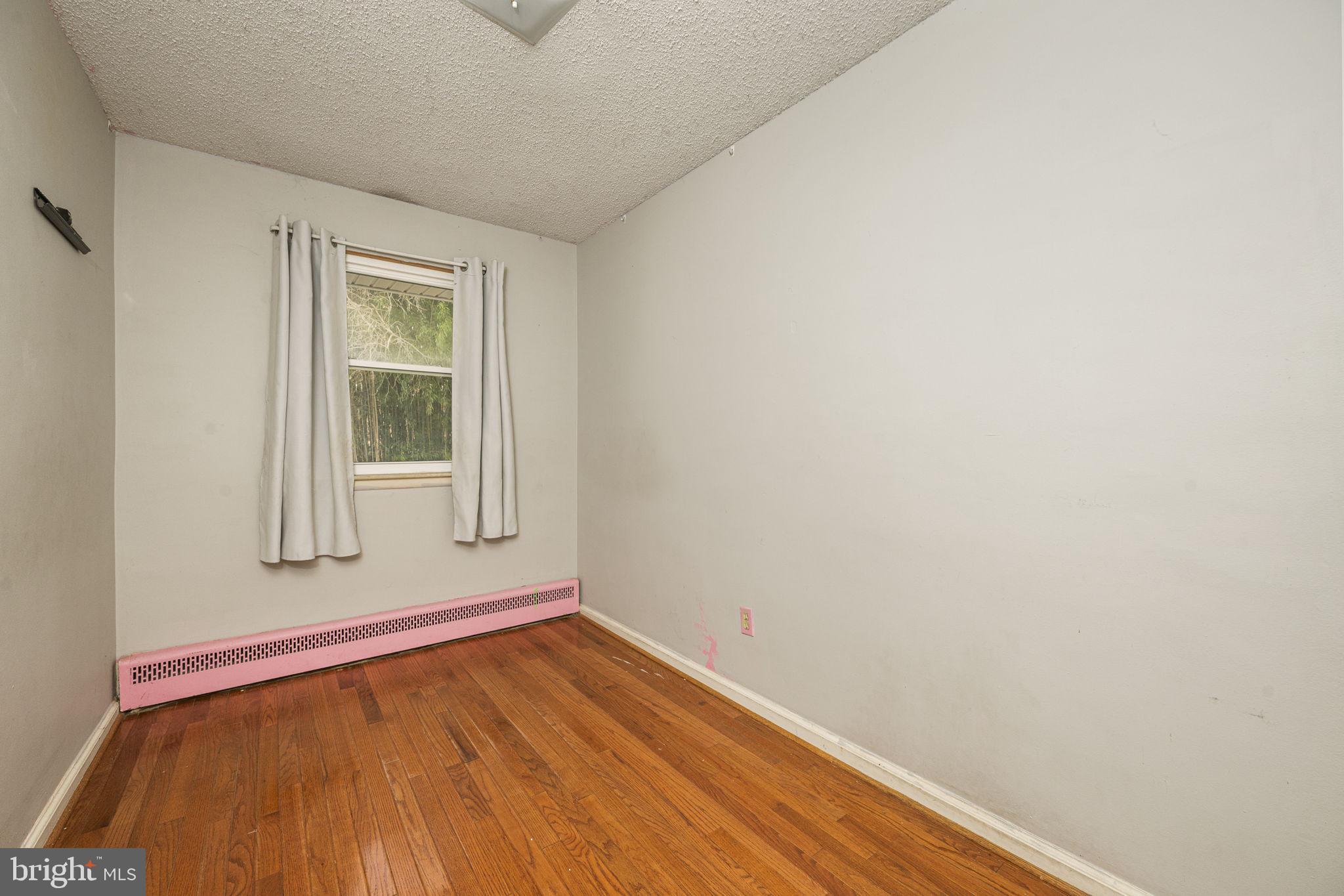 1016 West Boot Road Downingtown, PA 19335 - Photo 19 of 30 a view of a room with wooden floor and window
