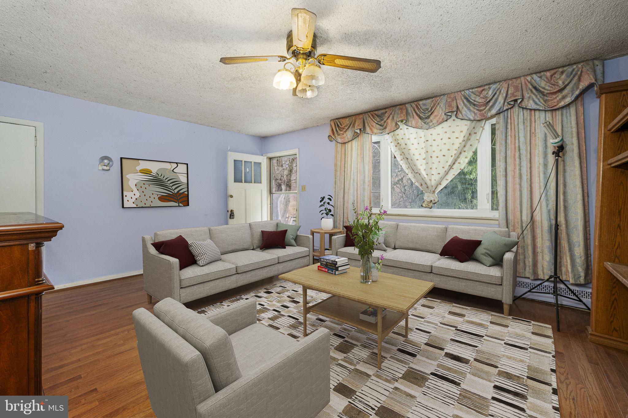 1016 West Boot Road Downingtown, PA 19335 - Photo 4 of 30 a living room with furniture a large window and a chandelier