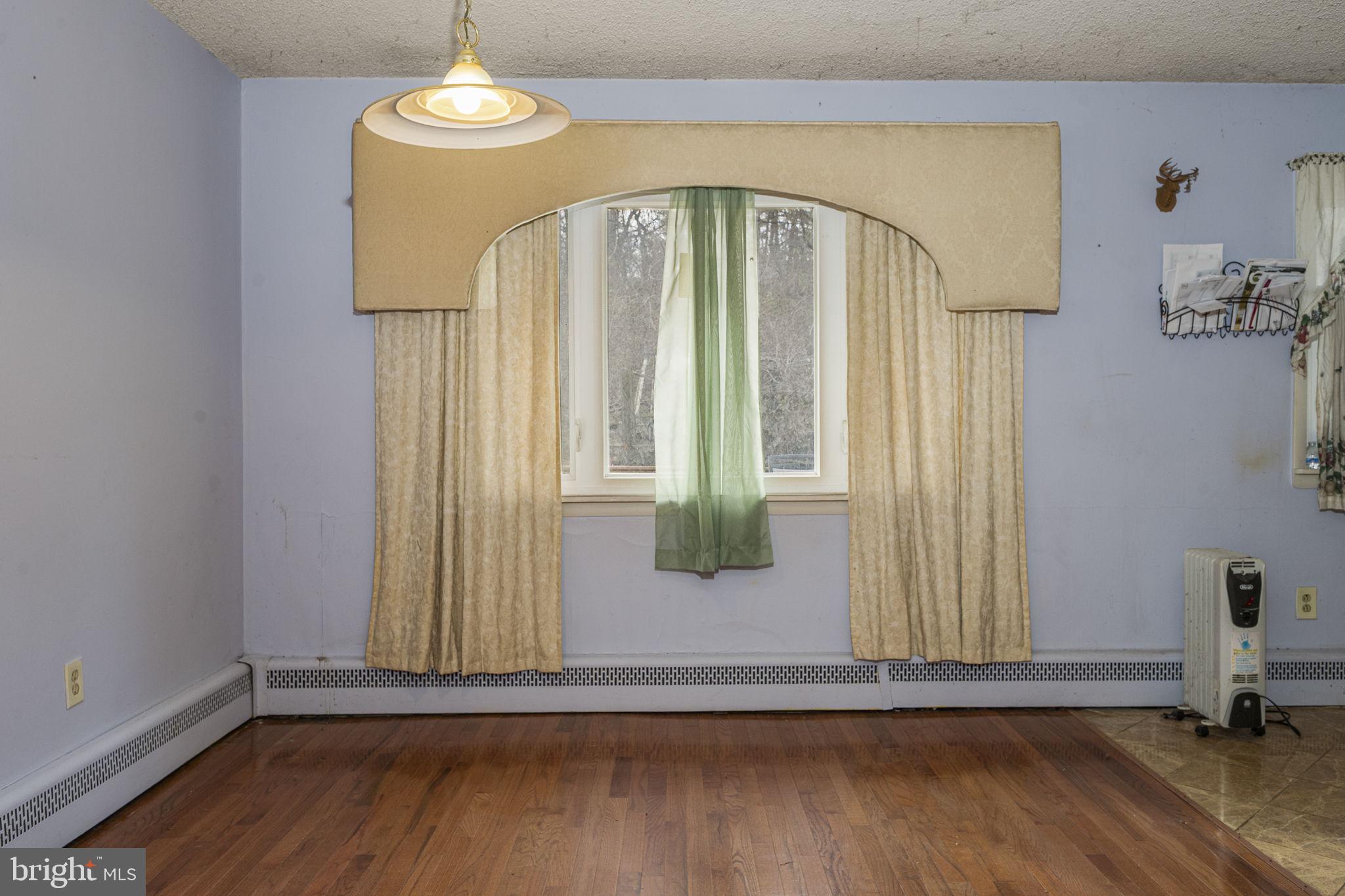 1016 West Boot Road Downingtown, PA 19335 - Photo 9 of 30 a view of a livingroom with wooden floor and door