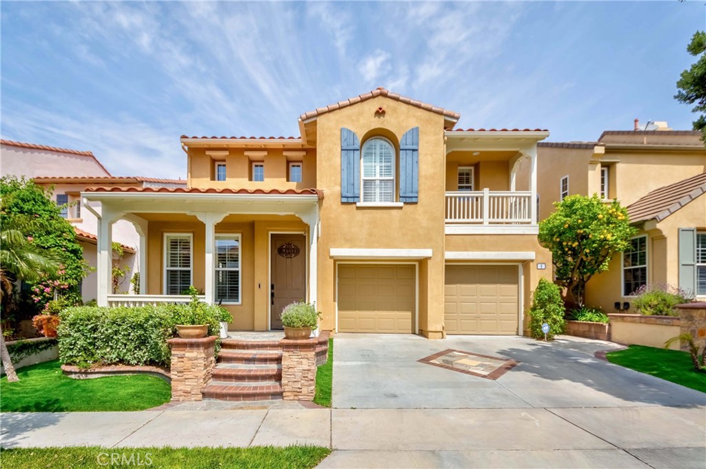 a front view of a house with a garden and plants