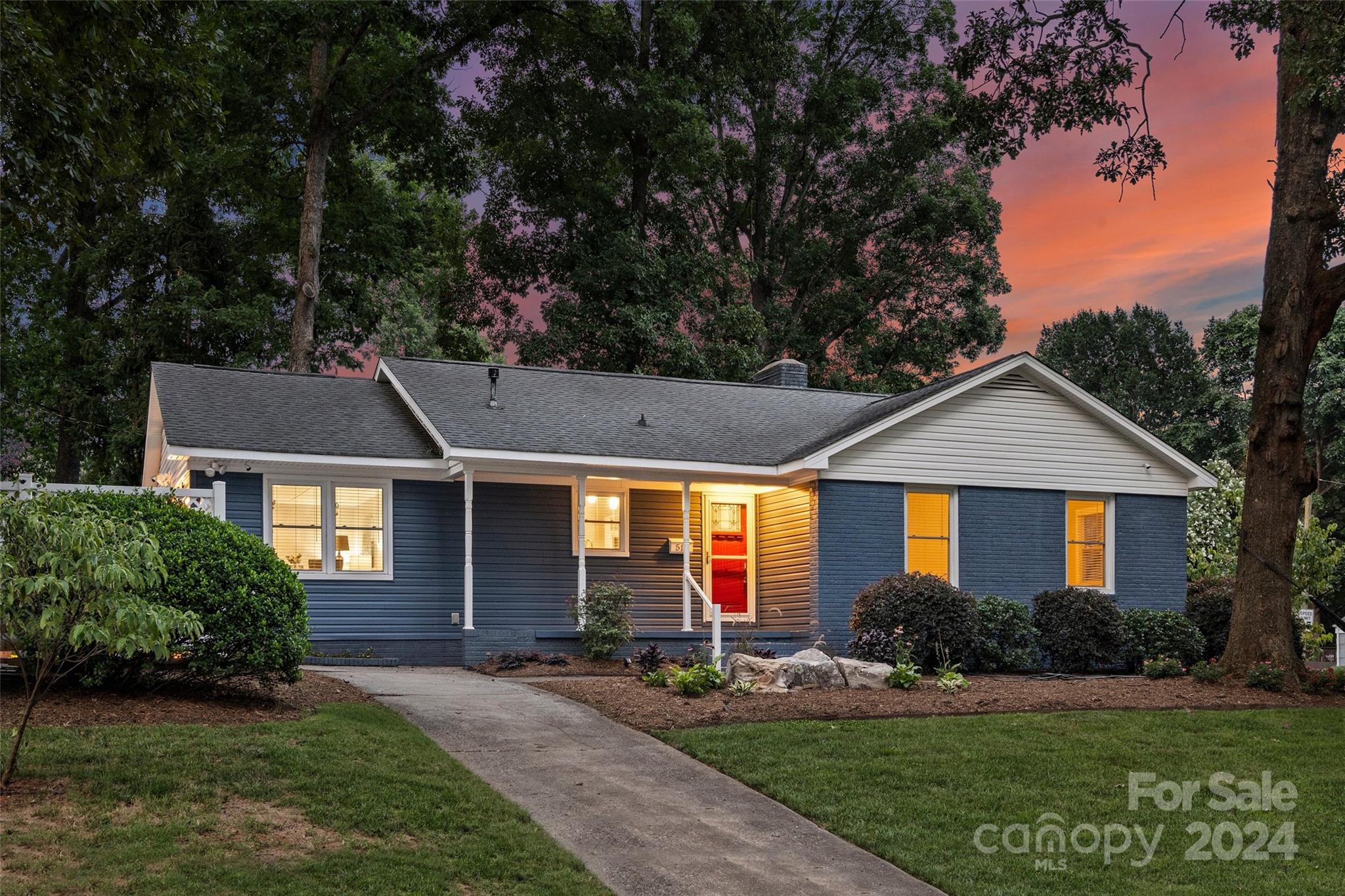 front view of a house with a yard