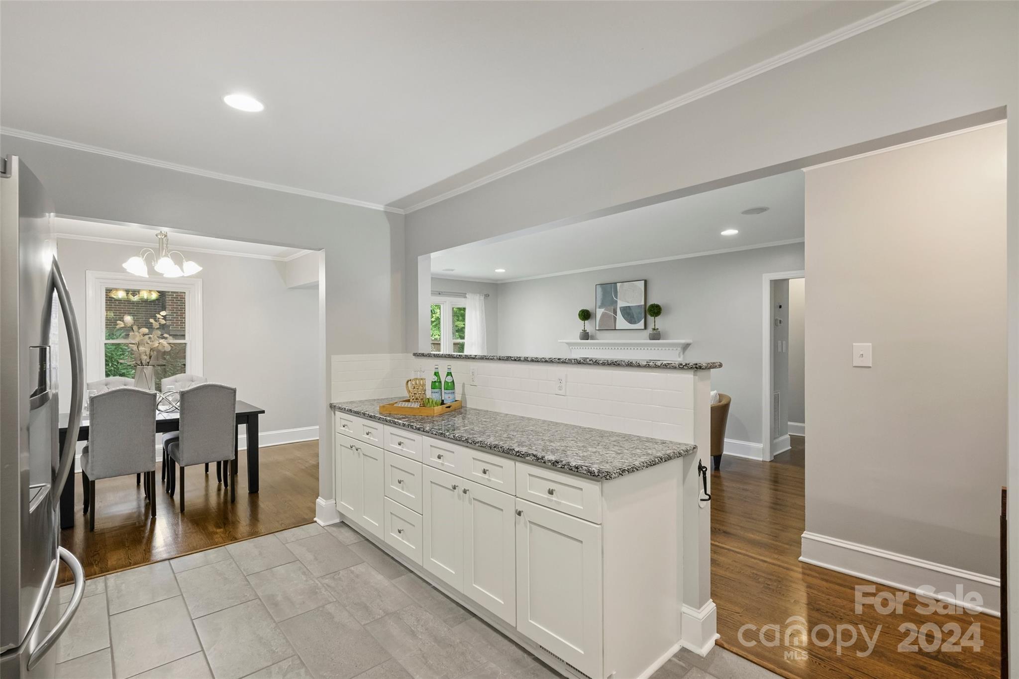 515 Bartling Road Charlotte, NC 28209 - Photo 13 of 42 a spacious bathroom with a granite countertop sink and a mirror