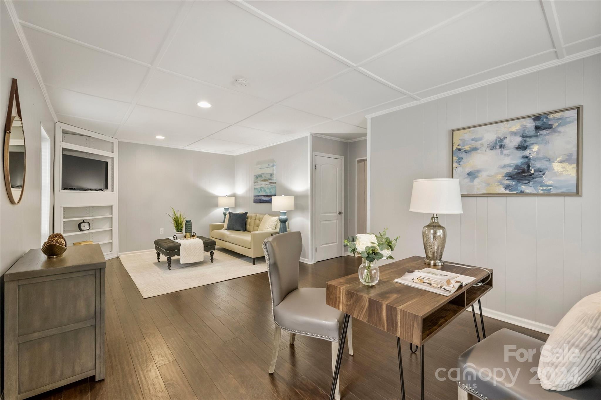 515 Bartling Road Charlotte, NC 28209 - Photo 16 of 42 a living room with furniture a wooden floor and a flat screen tv