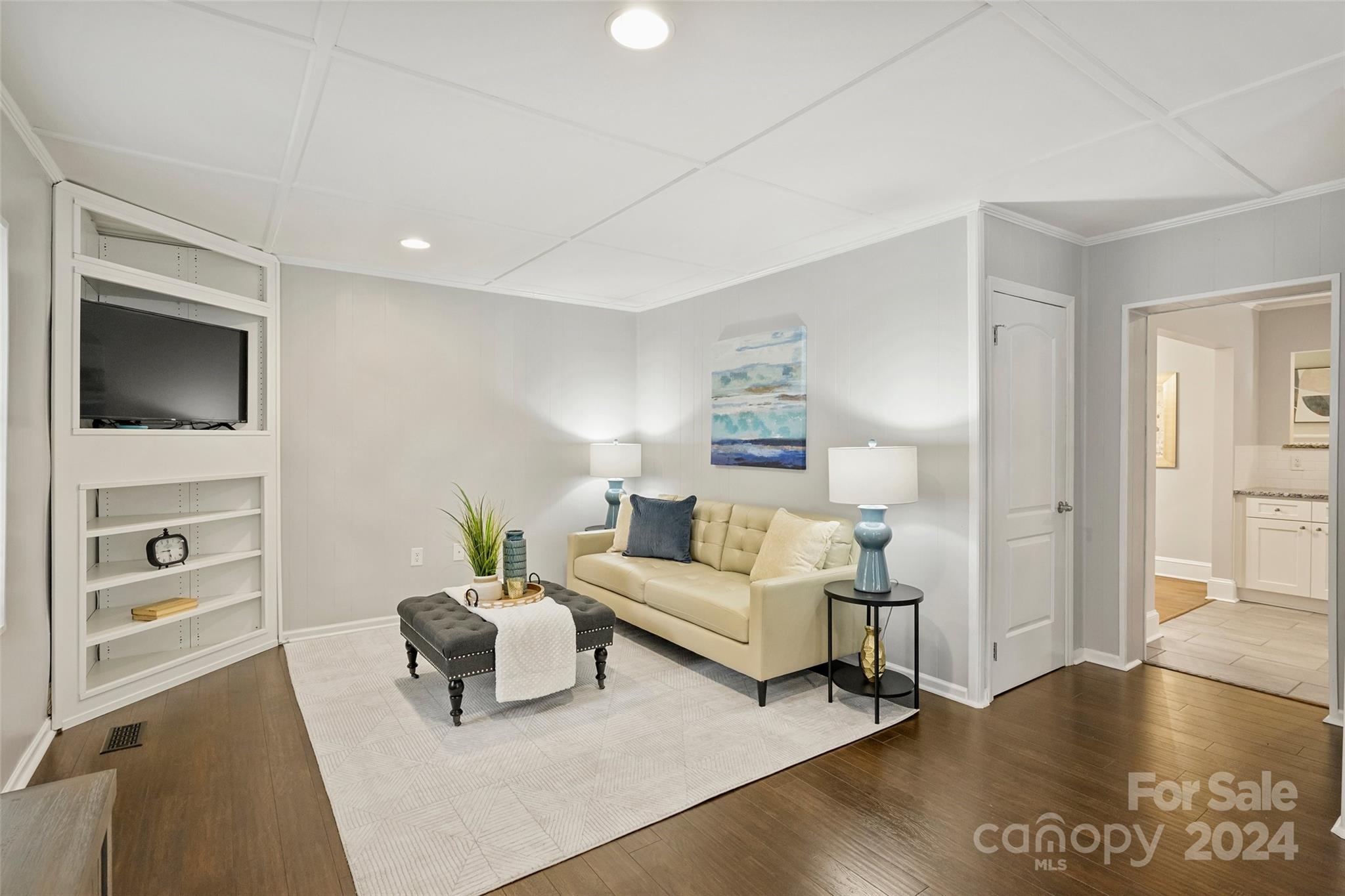 515 Bartling Road Charlotte, NC 28209 - Photo 17 of 42 a living room with furniture and a flat screen tv