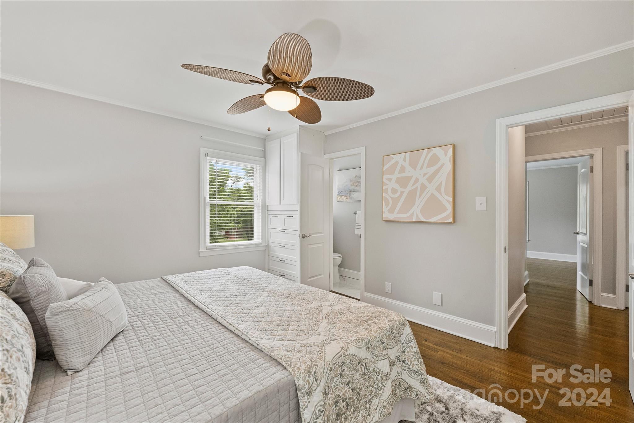515 Bartling Road Charlotte, NC 28209 - Photo 21 of 42 a bedroom with a bed and wooden floor