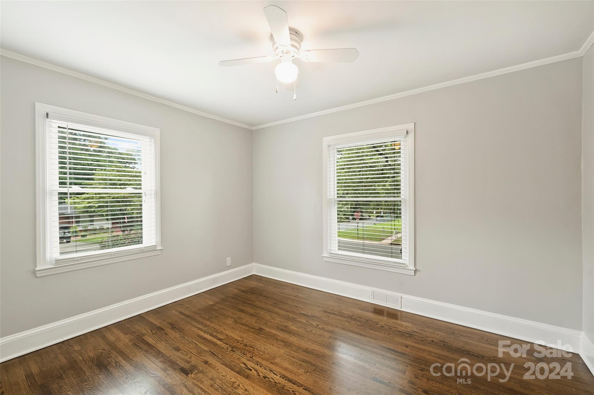 515 Bartling Road Charlotte, NC 28209 - Photo 26 of 42 a view of an empty room with wooden floor and a window