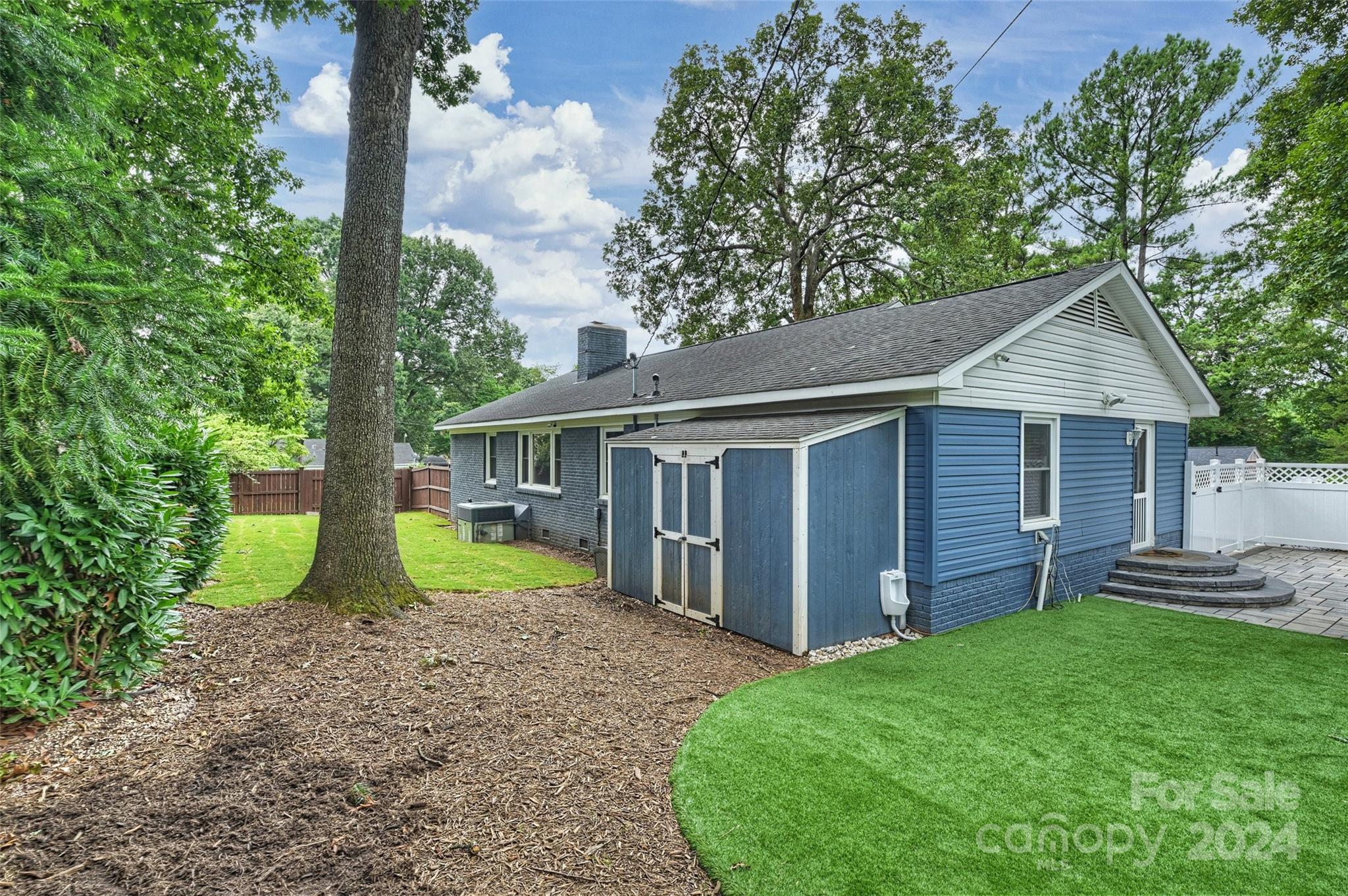 515 Bartling Road Charlotte, NC 28209 - Photo 38 of 42 a view of a house with a yard and potted plants